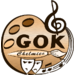Logo GOK w Chełmcu - paleta form, klucz wilinowy i maski teatralne
